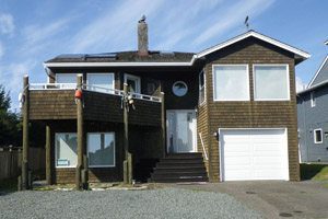 Two-story wooden-shingled house near the beach