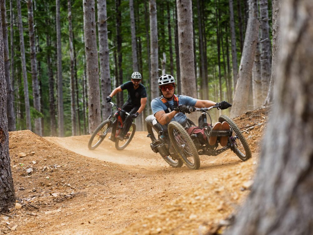 adaptive mountain biking recumbent trike dirt berm forest by benmoon