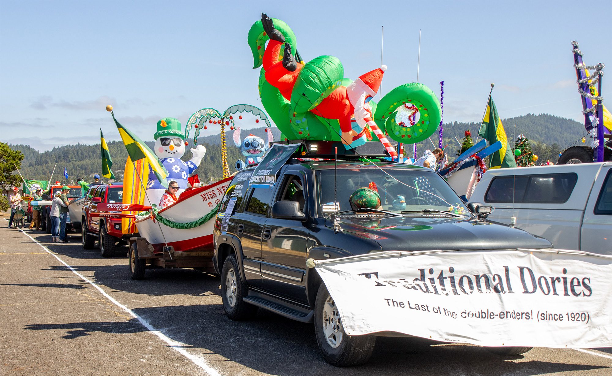 dory boat parade christmas in july 2025